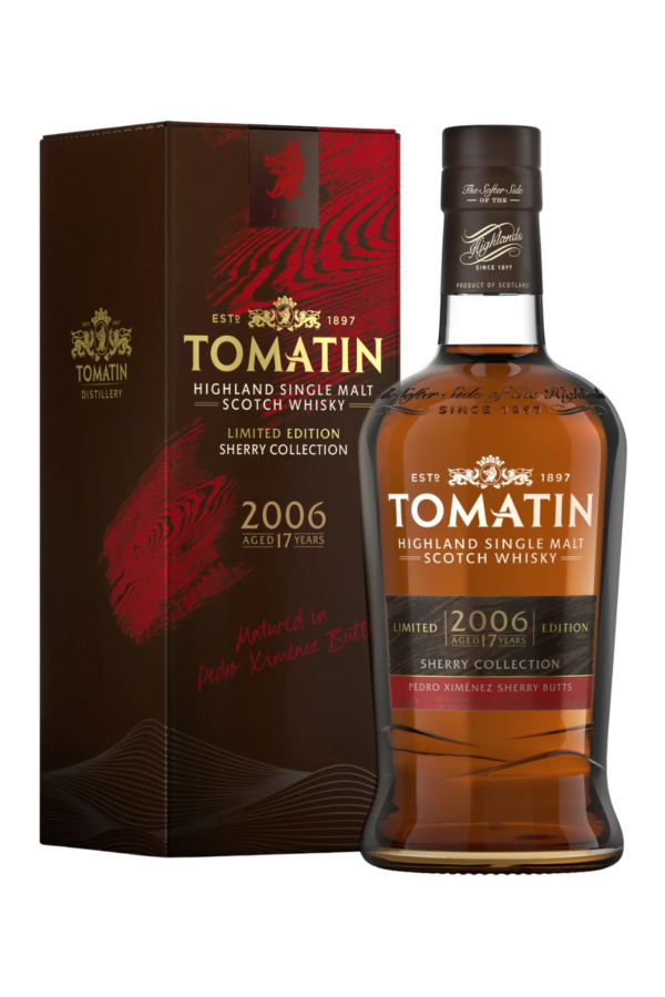 A bottle of tomatin whisky with a stunning box behind it. a full bottle of whisky with a lovely design